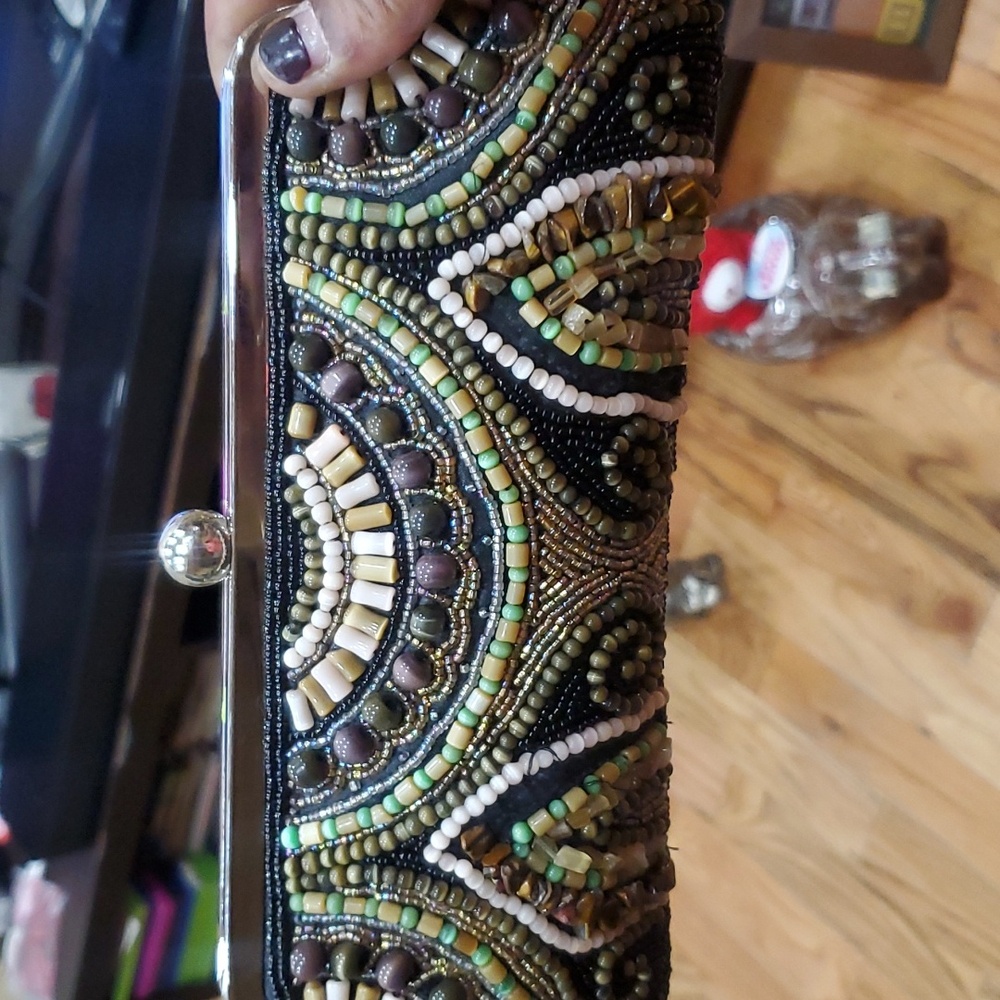 This is a nice beaded clutch  just some beads missing on one side ,not notice